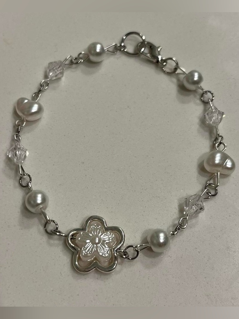 silver pearl and glass bead bracelet with flower charm